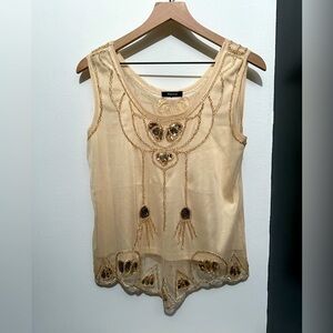 Verty gold sequined tank top.